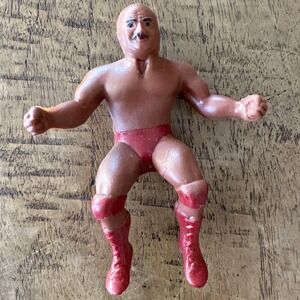Abdullah Butcher Rubber Wrestler Finger Puppet Figure Red Trunks Mustache Bald